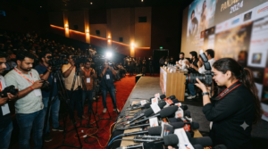 Pitt Siyapa promotion press event with cameras, microphones and cinema backdrop