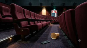 Telugu cinema lost property illustrated by a forgotten phone near a cinema seat